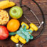 Image of fruits, a stethoscope, and measuring tape