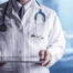 Male Doctor Holding Tablet Computer