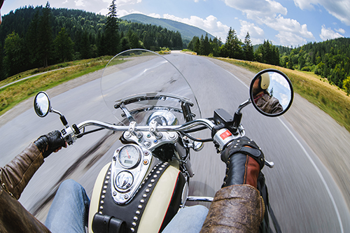 Wide angle shot of motorcycle on the road from perspective of rider