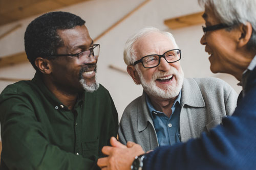 group of older adult men chatting