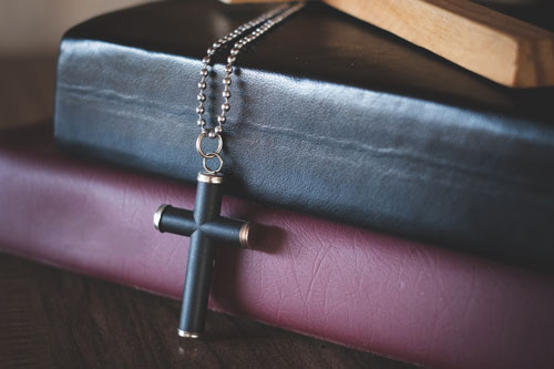 The crucifix lay on the bible.