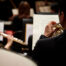 man playing a trumpet in a band