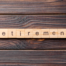 scrabble pieces spelling out retirement on a wooden table