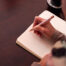 Close up shot of a hand writing.