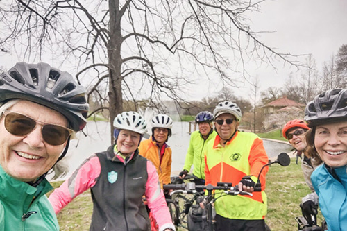 group of people biking in the winter