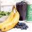 smoothie on counter with collagen container and bananas